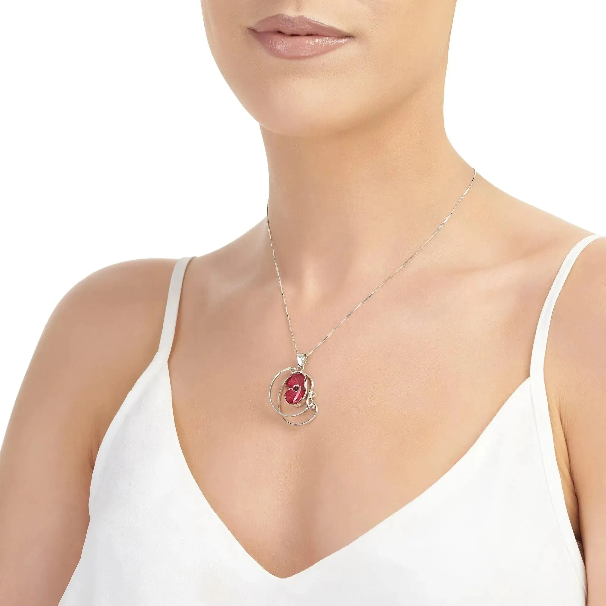 Sterling silver swirl pendant necklace with a mini poppy (Euphorbia milii)